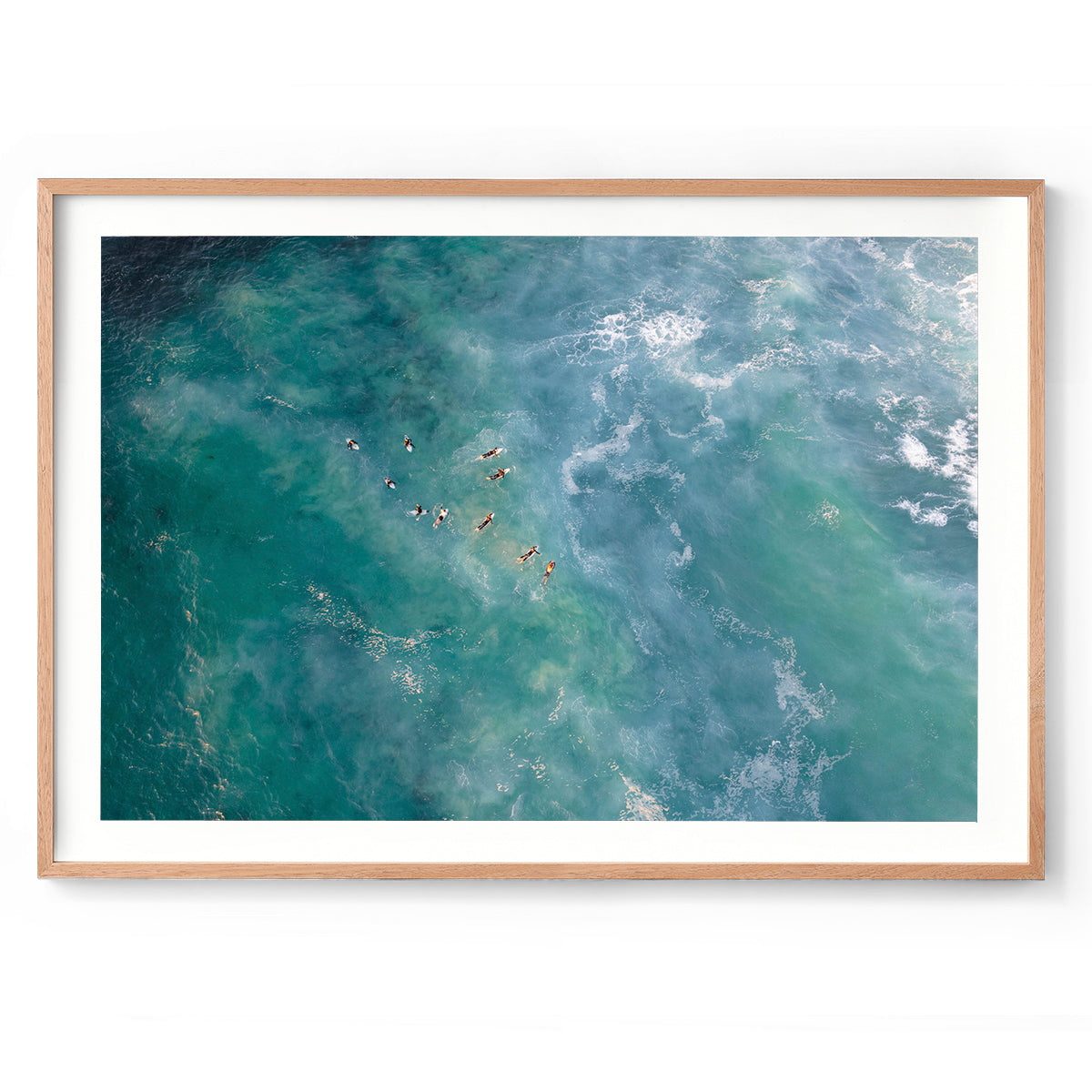 Horizontal drone photo of the ocean at Yallingup beach in Western Australia. Surfers wait for the waves to come in and are dotted all over the water. Original coastal fine art photography, available as prints and framed wall art. Perfect for your minimalist living room, dining room, bedroom or home office. Shipped free worldwide.