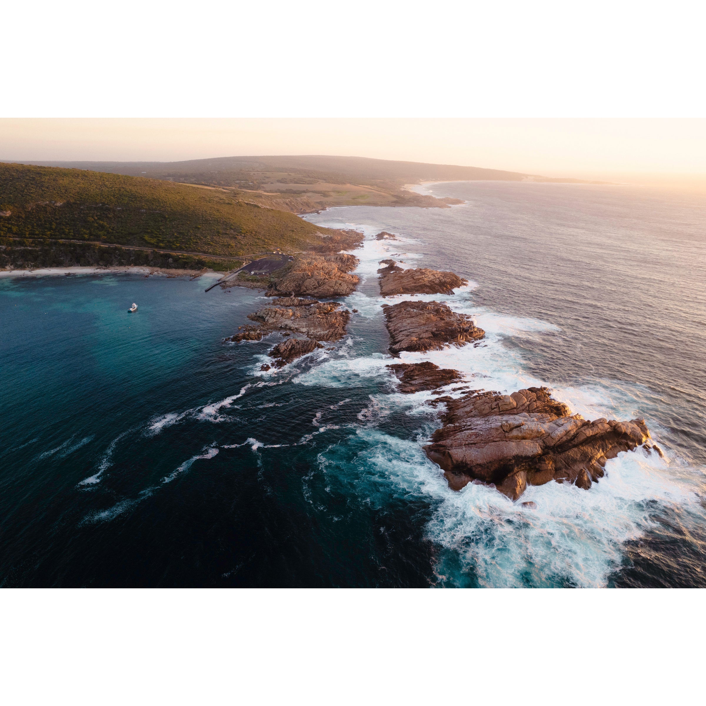 Horizontal photo of Canal Rocks in the south of Western Australia near Yallingup. It's shot with a drone looking across the rocks and ocean as the sun sets. Original fine art photography, available as prints and framed wall art. Perfect for your living room, dining room, bedroom or home office. Shipped free worldwide.