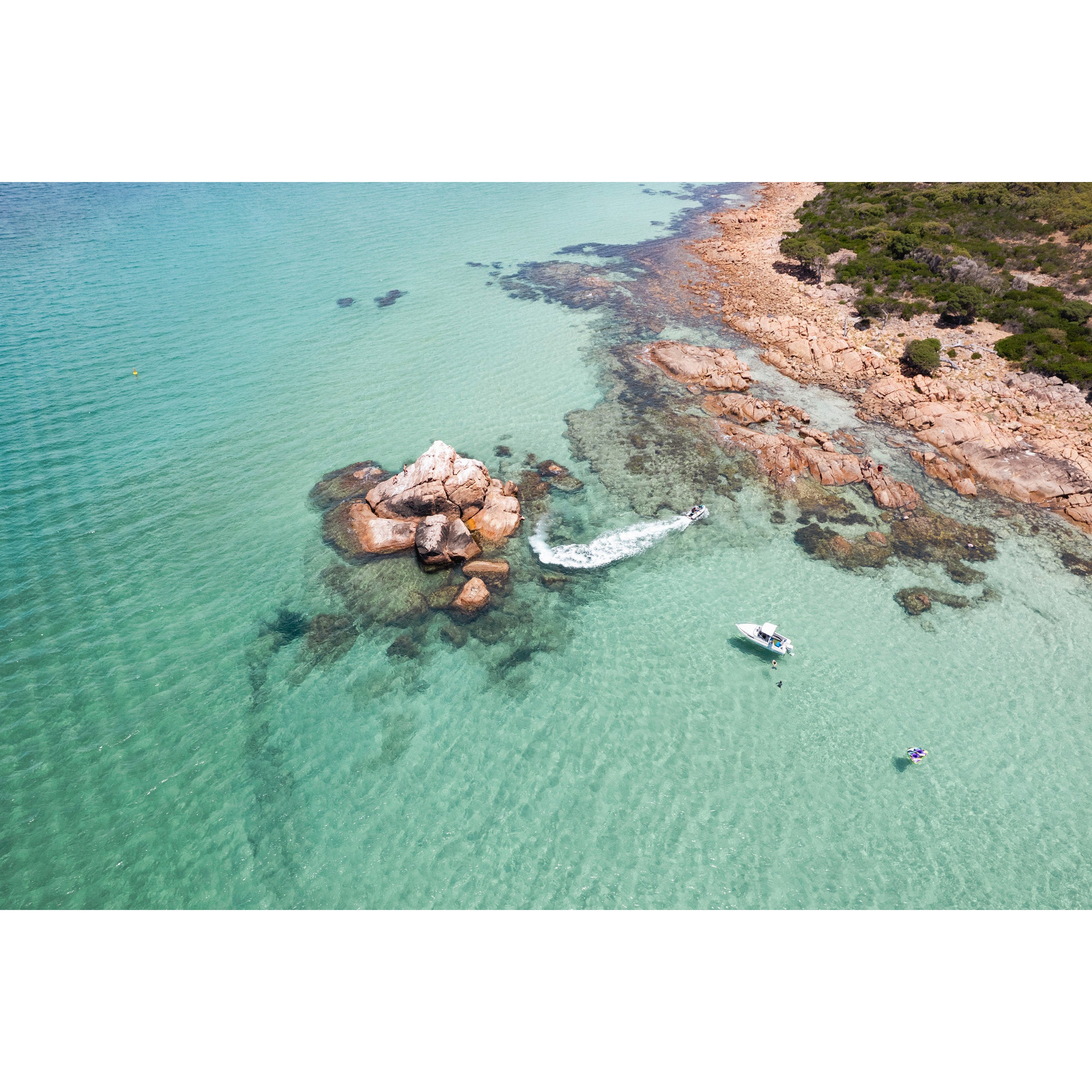 Horizontal drone photo of a boat and jetski in the turquoise ocean off the coast of Western Australia near Dunsborough and Meelup Beach. Original fine art photography, available as prints and framed wall art. Perfect for a coastal home or beach house.
