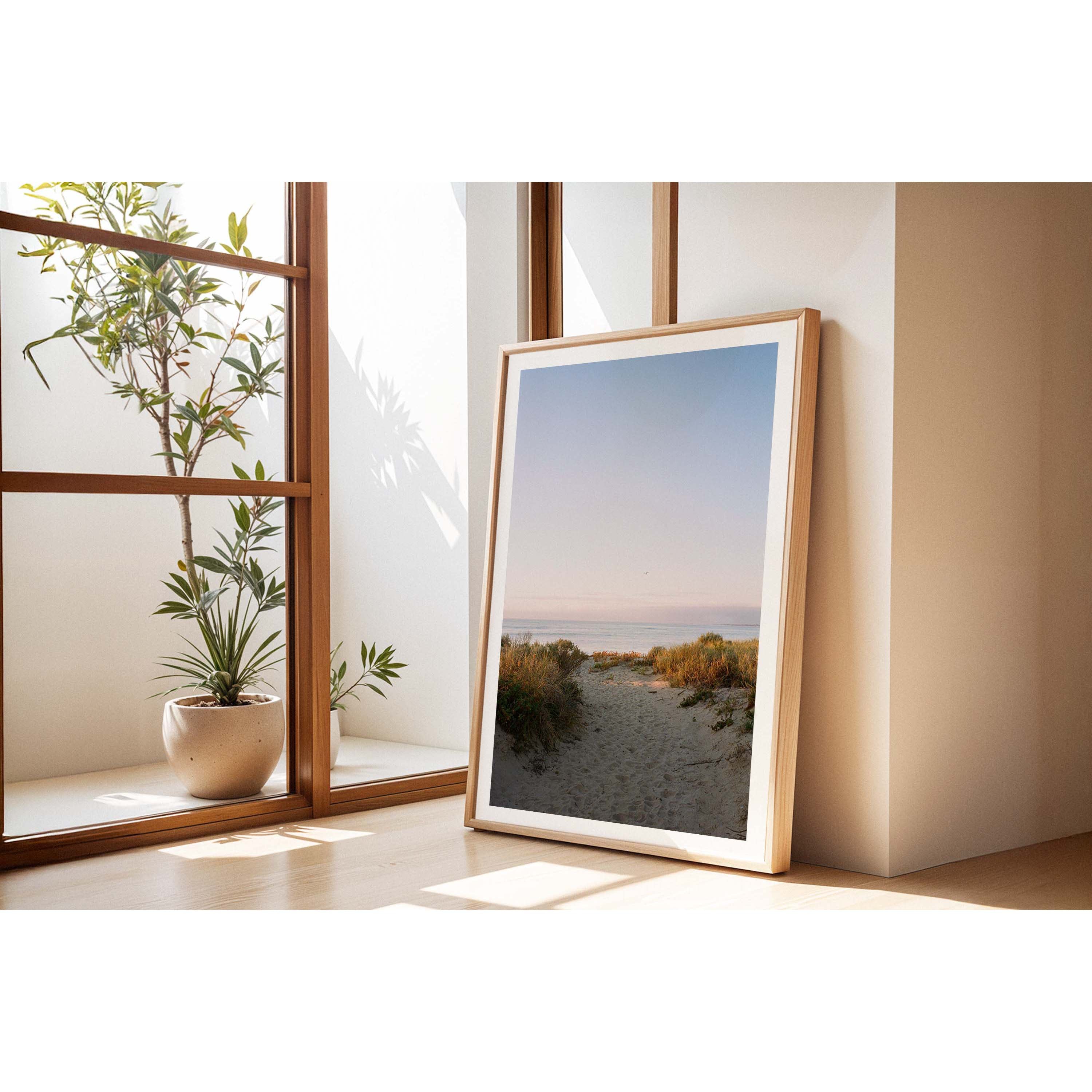 Vertical photo of a beach sand path leading towards the ocean. Shot at sunset on film with a beautiful soft blue and purple sky. Original fine art photography, available as prints and framed wall art. Perfect for the minimalist coastal home or beach house.