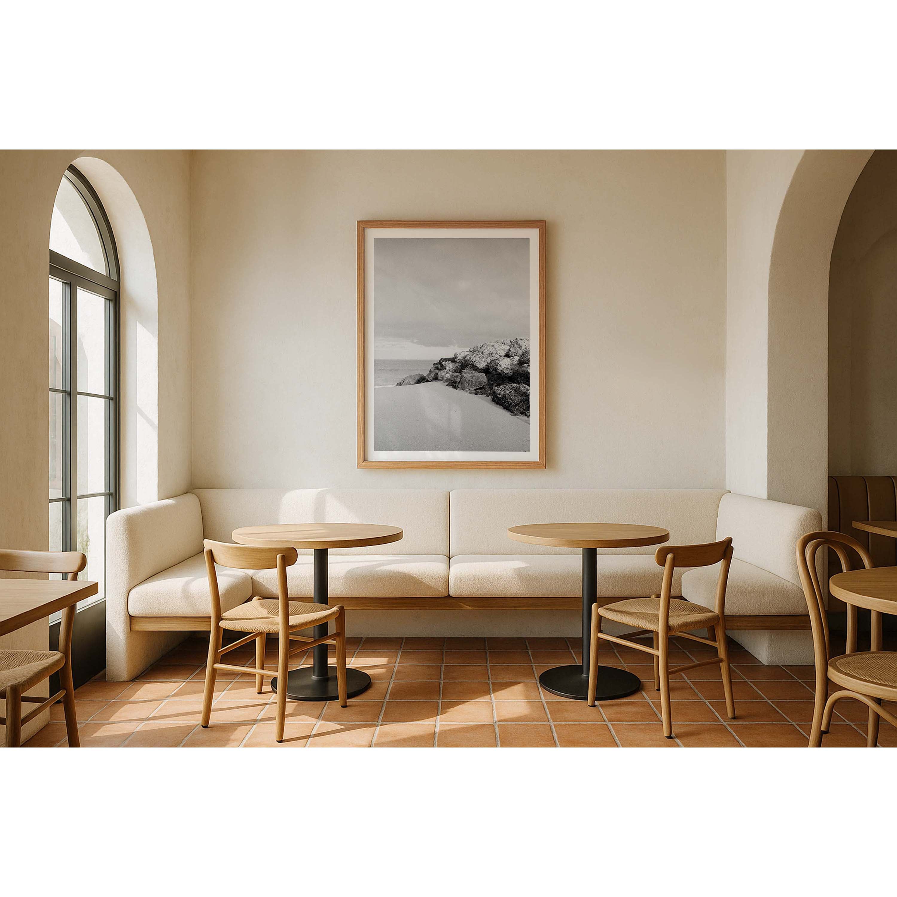 Vertical black and white photo shot on film of some rocks looking out towards the ocean at a beach in Western Australia. Very minimalist and soft. Perfect for a luxury coastal interior or beach house. Available as framed wall art or unframed prints.