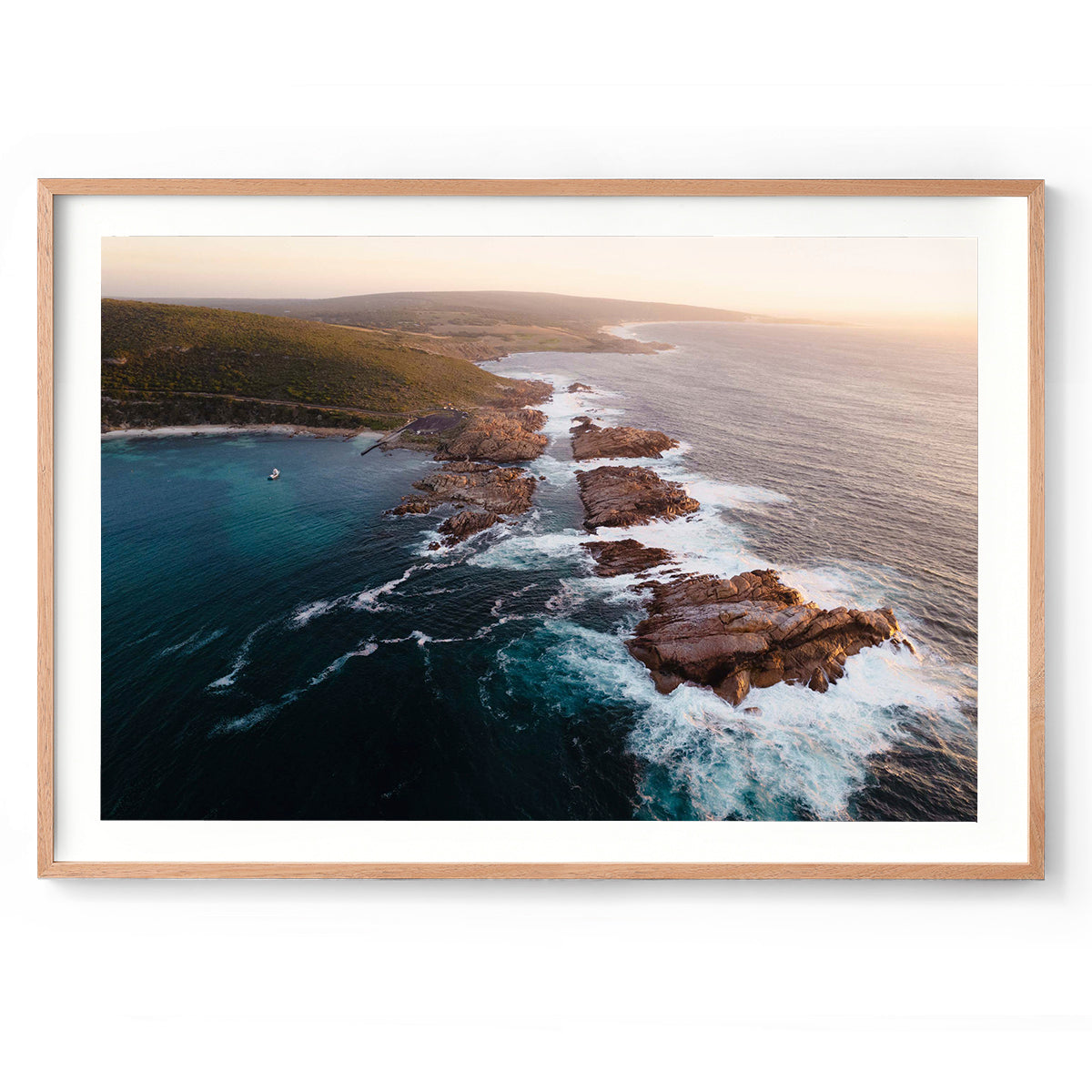Horizontal photo of Canal Rocks in the south of Western Australia near Yallingup. It's shot with a drone looking across the rocks and ocean as the sun sets. Original fine art photography, available as prints and framed wall art. Perfect for your living room, dining room, bedroom or home office. Shipped free worldwide.