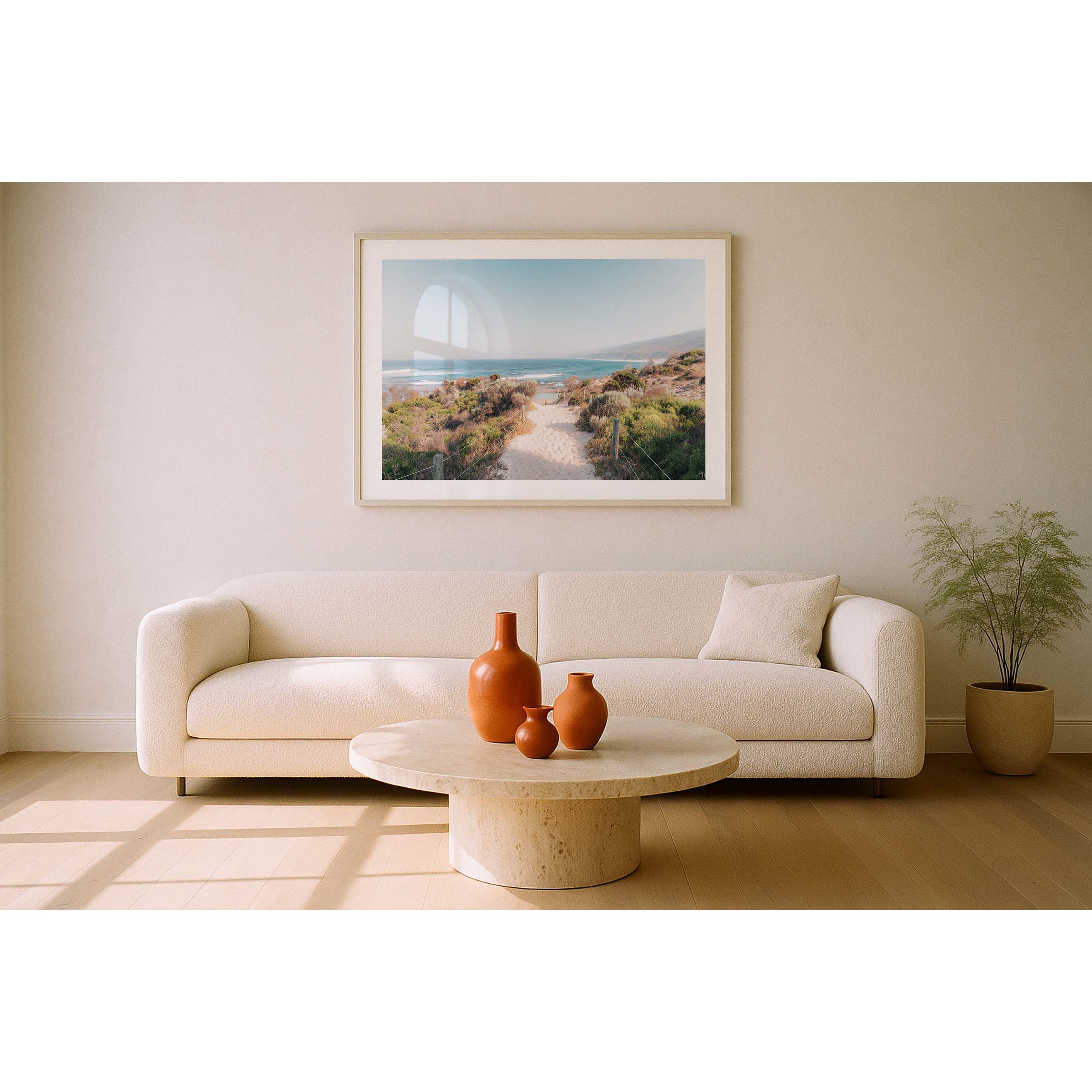 Framed photo of the sandy beach path leading down towards Yallingup Beach in Western Australia. The bush frames the path with the blue ocean and cliffs at the end. Available framed in black, white or oak.