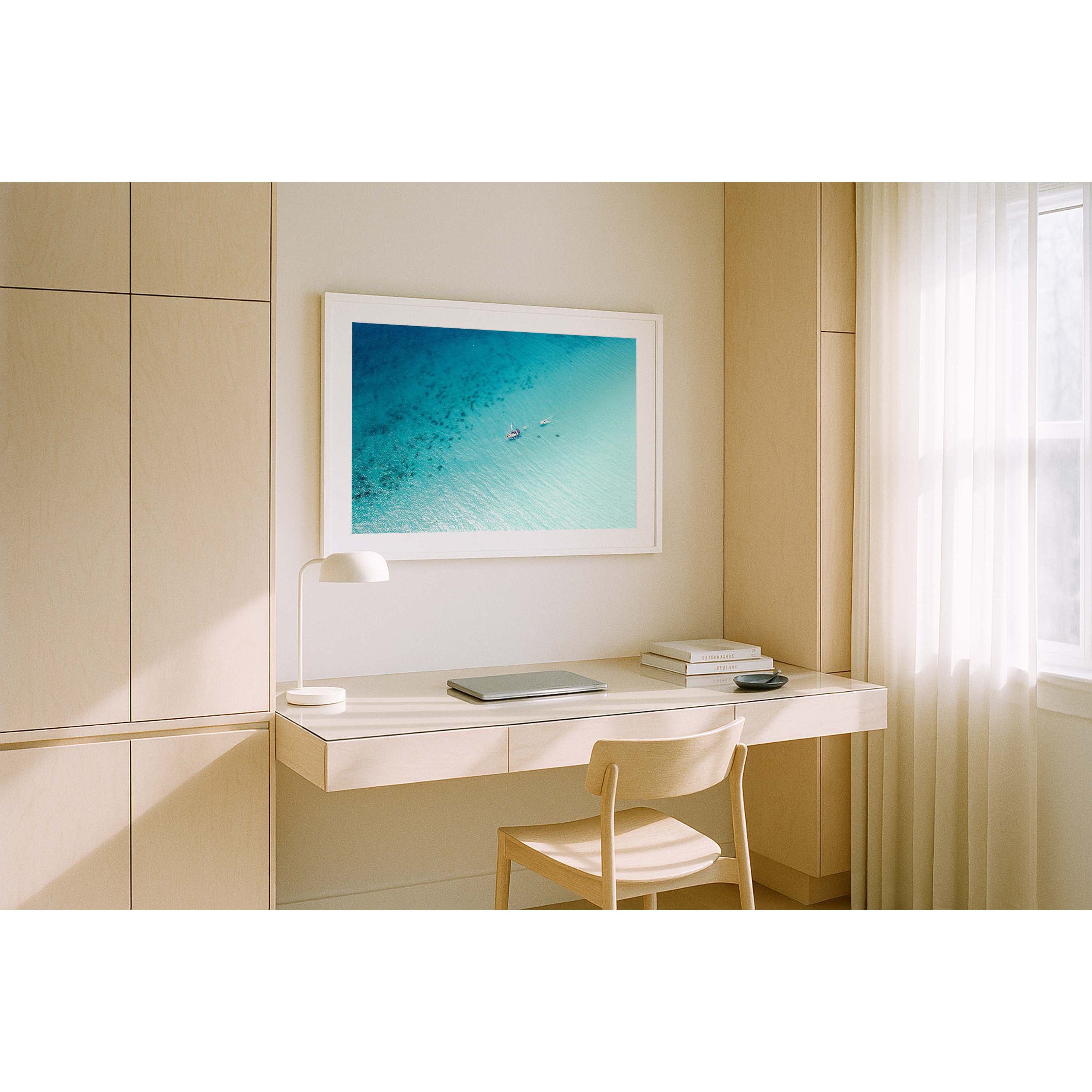 Horizontal drone photo taken at Eagle Bay in Western Australia, the ocean is blue and sparkling and there is a singular boat floating through the water. Minimalist fine art photography for coastal interiors and beach homes. Original framed wall art, exclusive to Host Studio. 