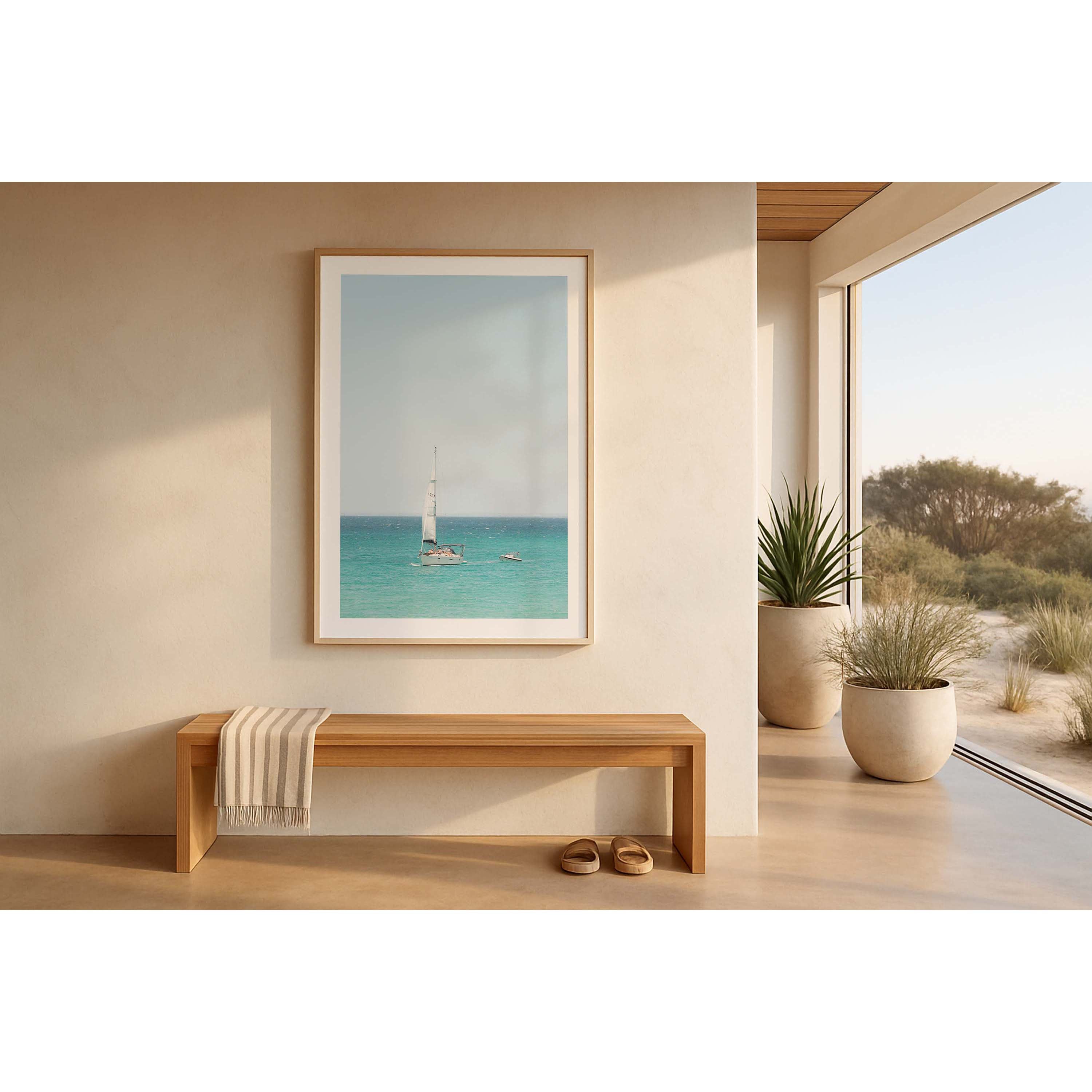 Colour photo of a sailboat on the water off Eagle Bay in Western Australia, tugging a smaller boat. There are people sunbathing on the deck. Fine art photography print, available framed in black, white or oak.